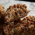 Mena Protein Bars made with oats, seeds, and dried fruit.